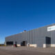 Fachada principal de la planta de WindWaves en As Somozas (A Coruña), donde fabrica estructuras y componentes para eólica marina. Firma: Amper